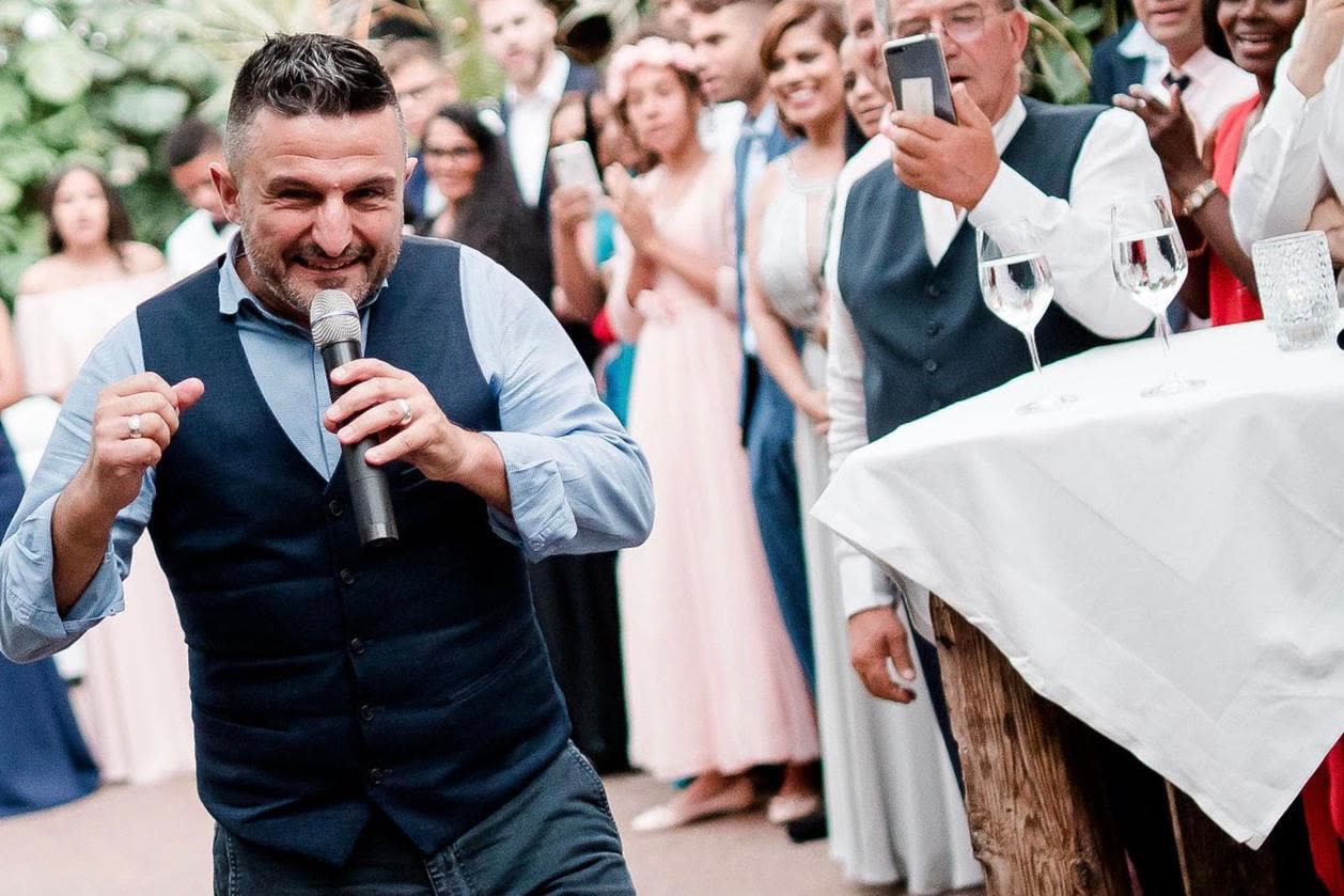 DJ Cardillo performing with a microphone